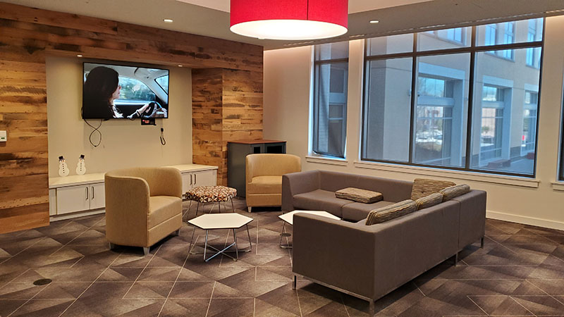 A seating area with a loveseat and arm chars at the Living and Learning Commons ELS student residence at Saint Joseph's University in Philadelphia, Pennsylvania, USA.