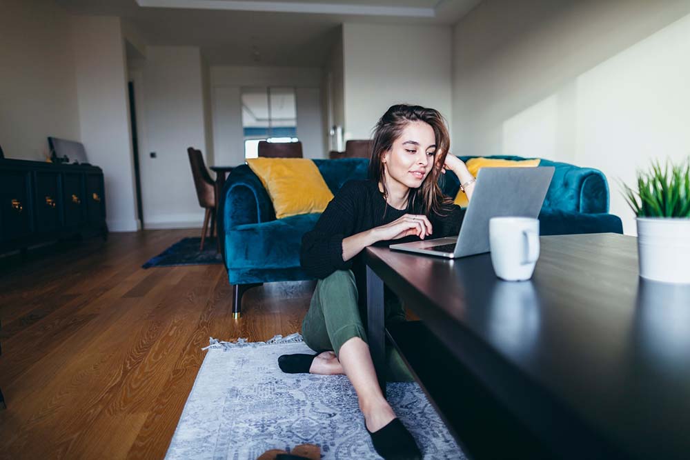 Homestay_Girl_Working_on_Living_Rm_Floor