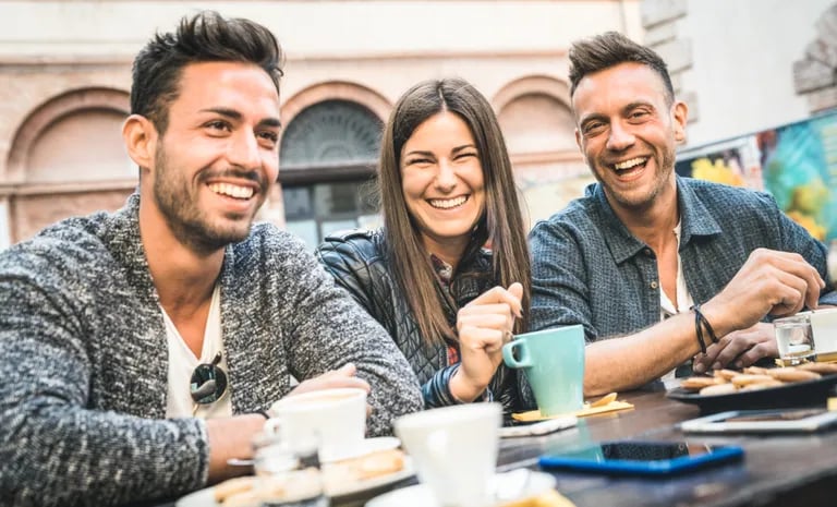 three_students_eating_and_laughing_together