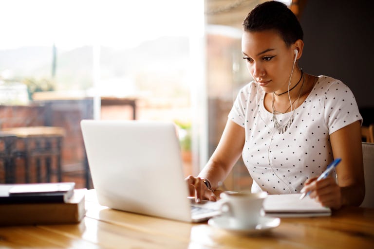 An English language student in the USA studying English online on her laptop