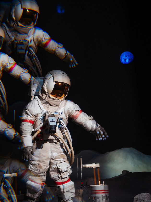 An image of an astronaut in space with a planet in the distance.
