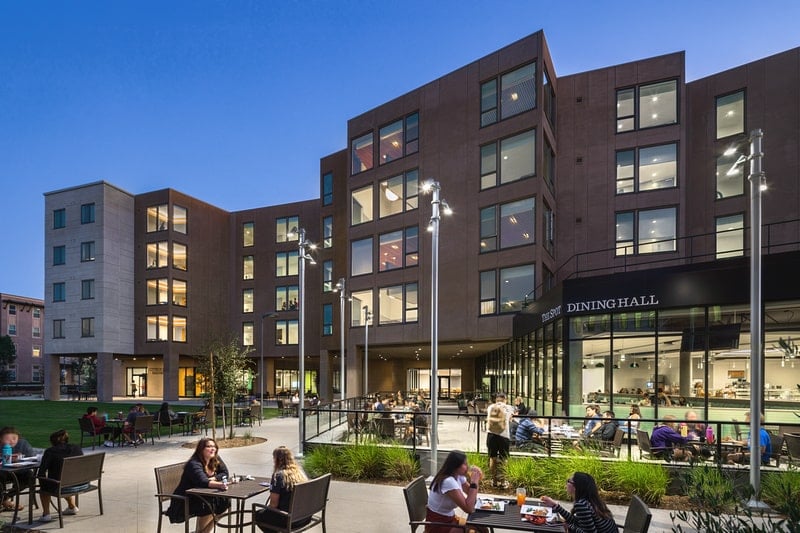 An evening view of students seated outside of the University of La Verne Campus Residences which is home to ELS Los Angeles County Students in California, USA.