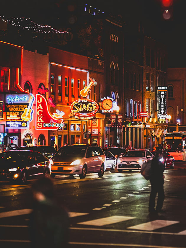 A nighttime view of the Broadway Honky Tonk Highway in Nashville, Tennessee, USA near ELS Language Centers.