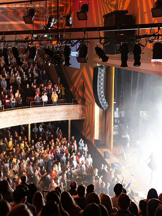 An audience watching a show inside the Ryman Auditorium in Nashville, Tennessee, USA near ELS Language Centers.